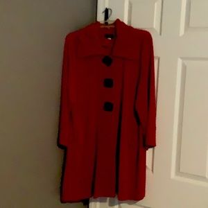 Like new. Red jacket with black chunky buttons.